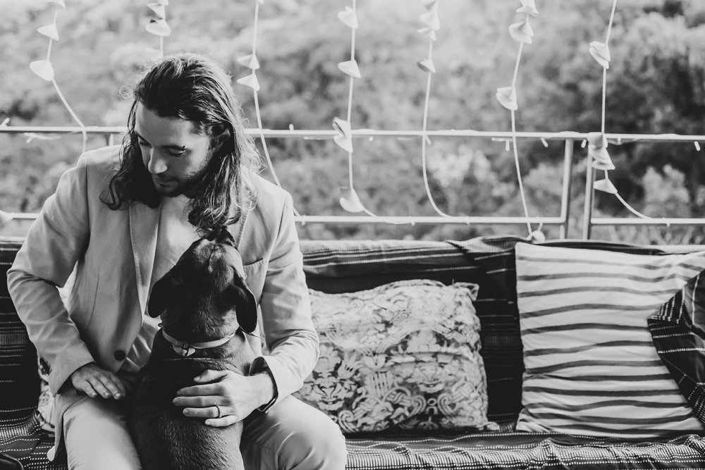 intimate beach wedding groom with furkid