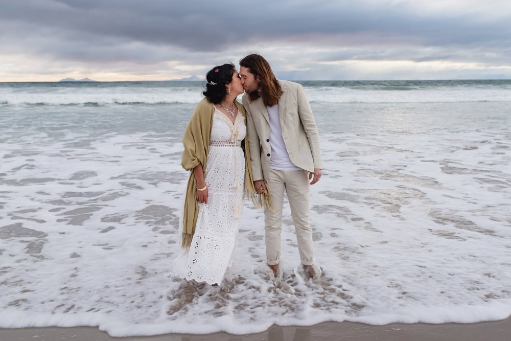 intimate beach wedding couple in water
