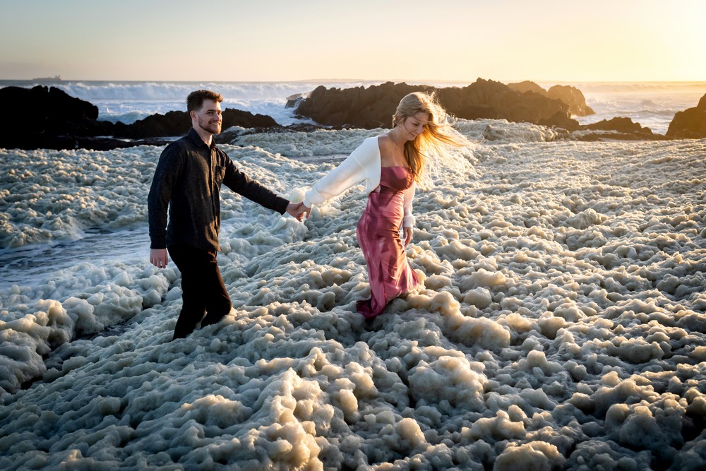 Cape Town Proposal Photography Couple in wild foamy ocean