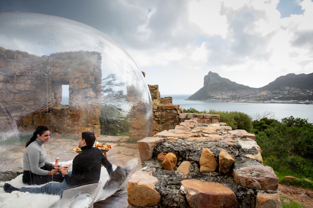 Cape Town proposal photography with couple in unique plastic bubble amongst the ruins