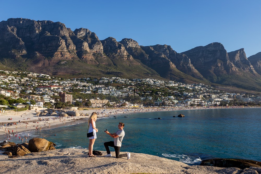 Cape Town Proposal Photography with epic views of the mountains as he pops the question